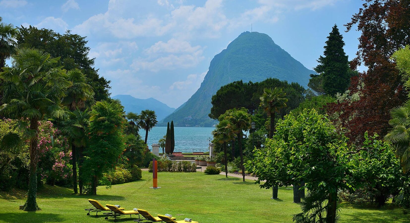 Tropical gardens leading down to the lake